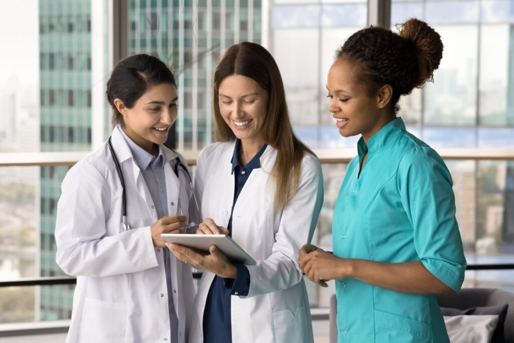 Doctors looking at tablet